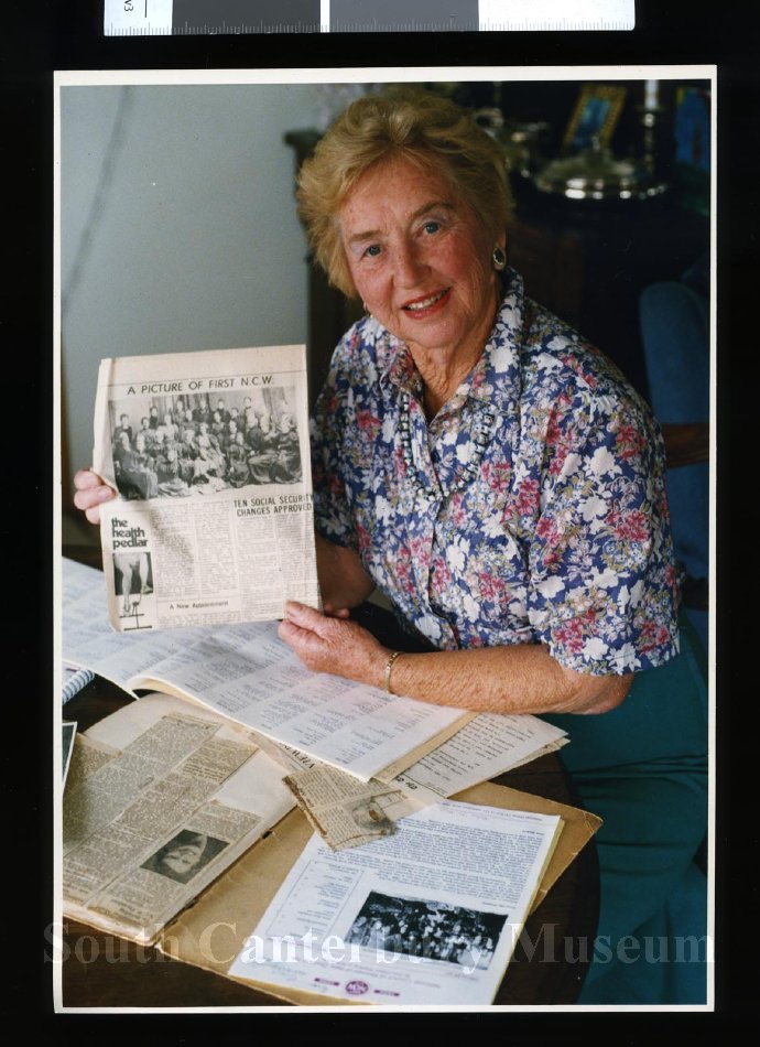 20121862888 Joan Evans with newspaper National Council of Women 11 April 1996