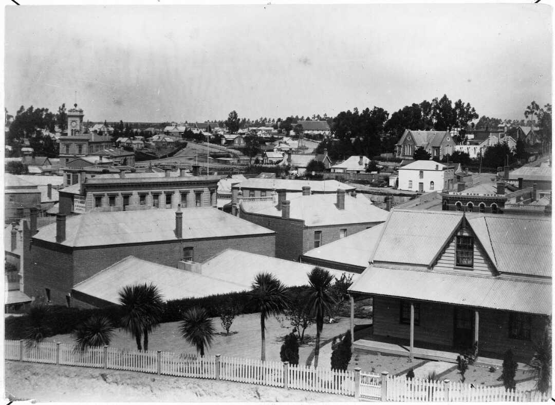 Looking over rooftops in Timaru circa 1888 The Post Office Butler Street St Marys Church Church Street and the Old Bank Hotel are visible