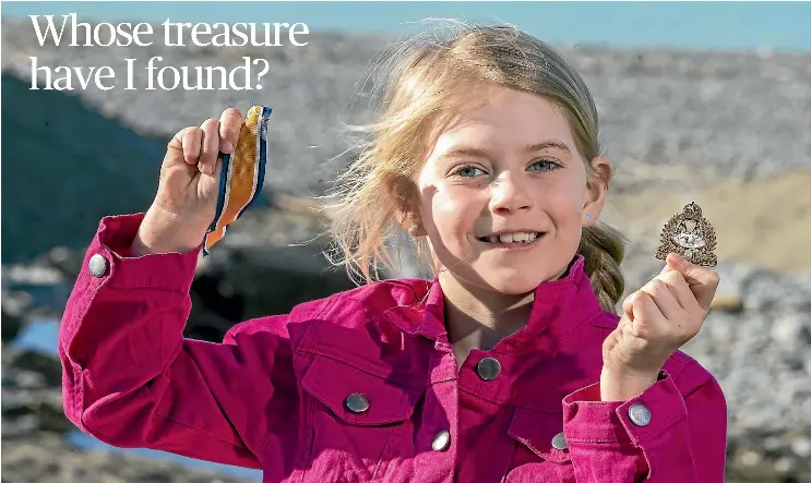 Medinella Fauth with the medal she found at Patiti Point 2021 Timaru Herald