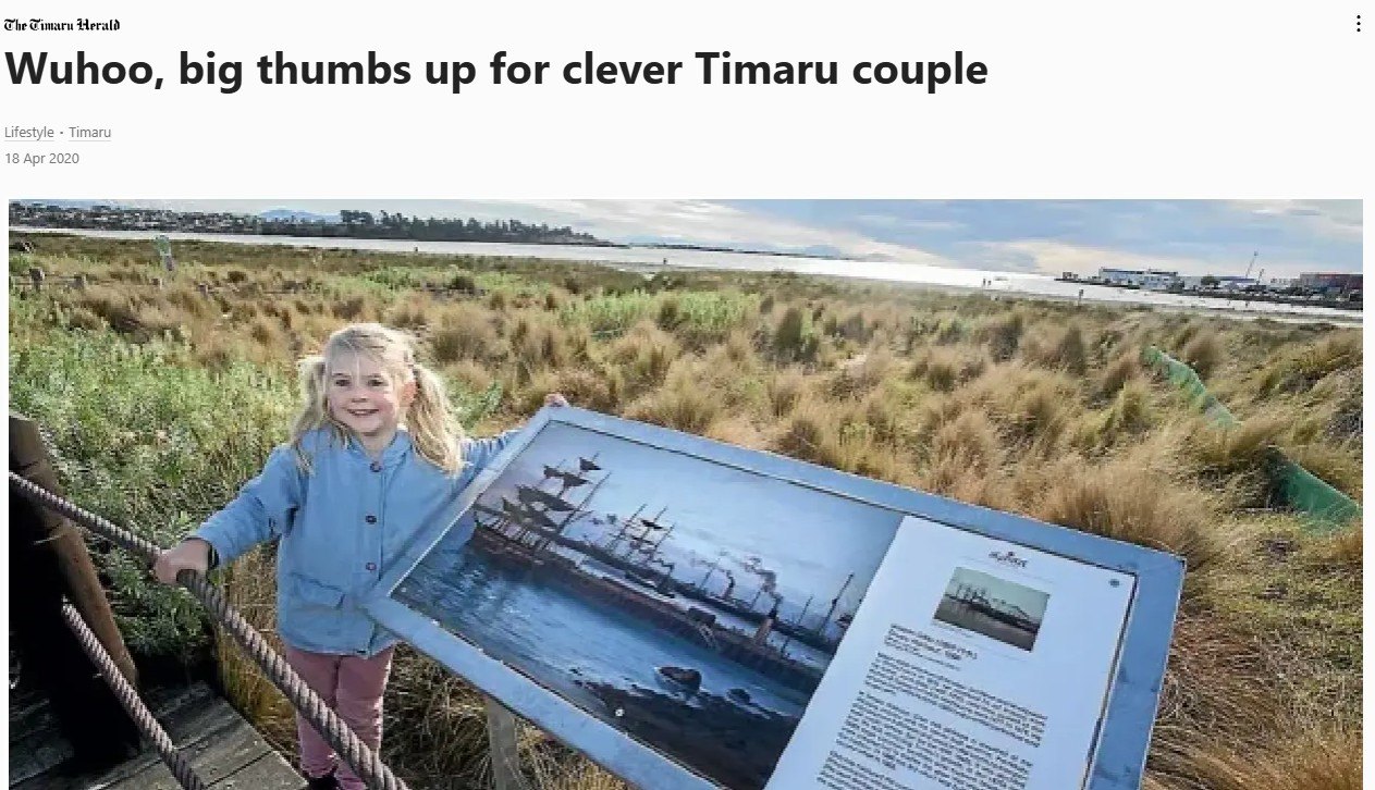 Medinella Fauth beside a Wuhoo sign at Caroline Bay created with the help of her parents Roselyn and Chris Fauth and the Aigantighe Art Gallery