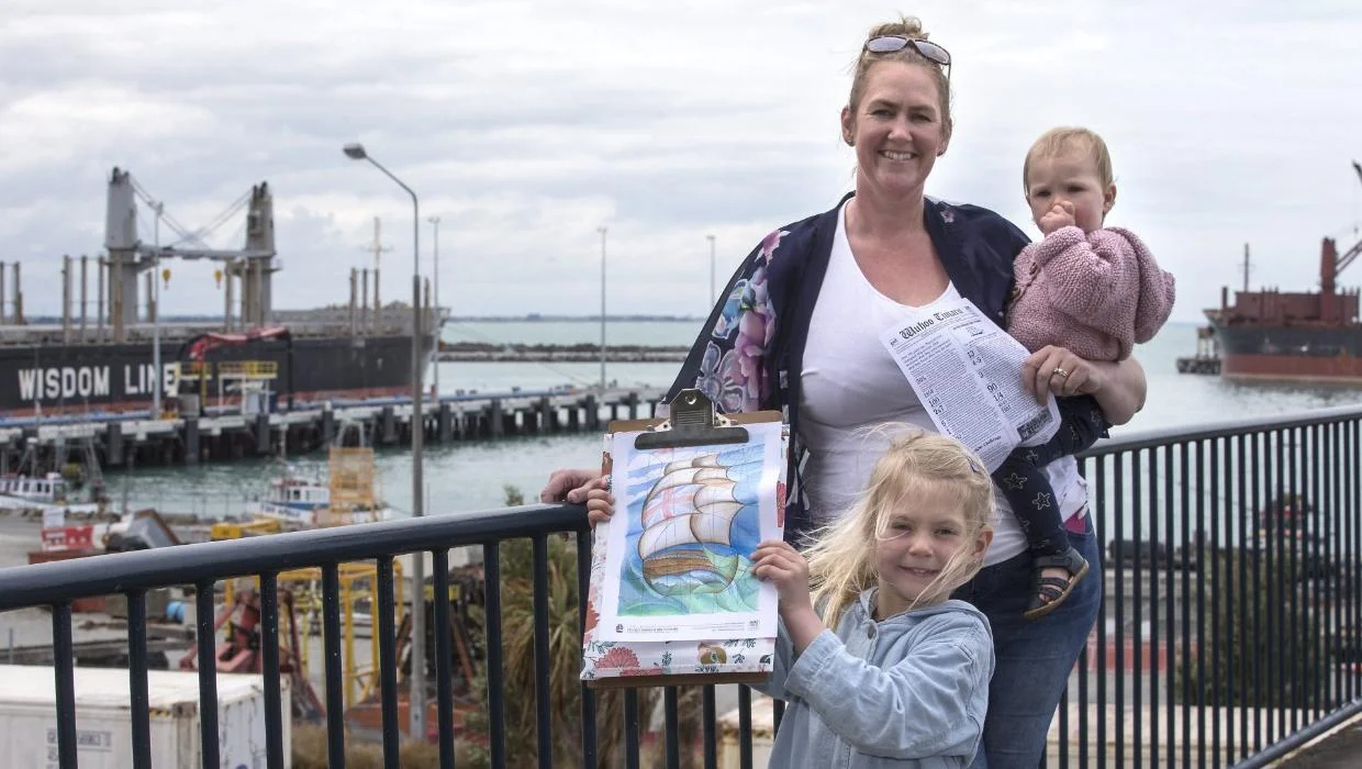 Roselyn Fauth pictured with her children Medinella and Annabelle with a fact and colouring sheet she created last year to commemorate the 161st anniversary of the Strathallan leaving for Timaru